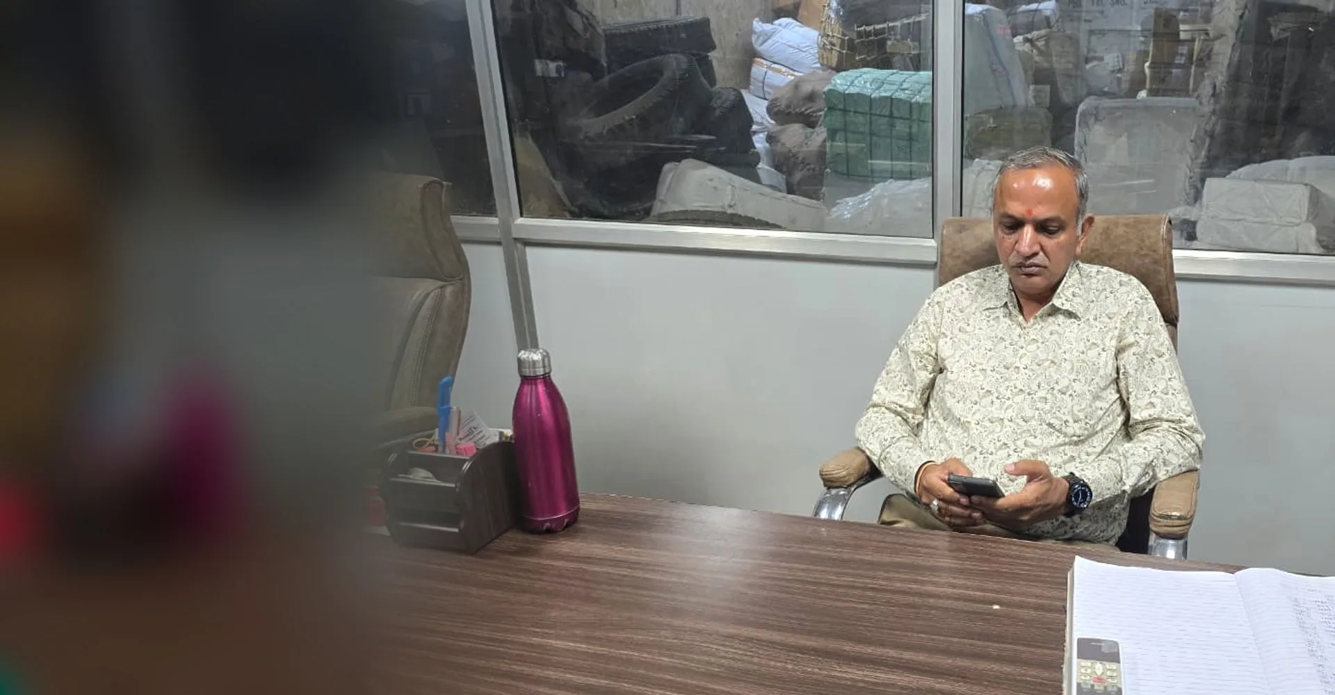 Sanjay Gupta, Owner of Shimla Manali Goods Carrier Pvt. Ltd., at his desk in the Chandigarh booking office